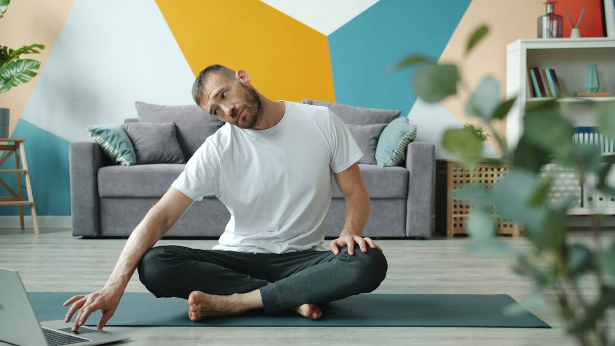 Man performing gentle seated prostate exercises for men with calm focus